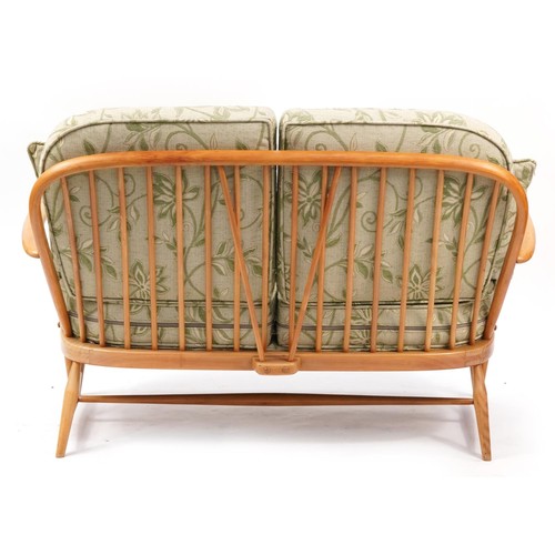 894 - Ercol light elm Windsor two seater settee, 131cm wide