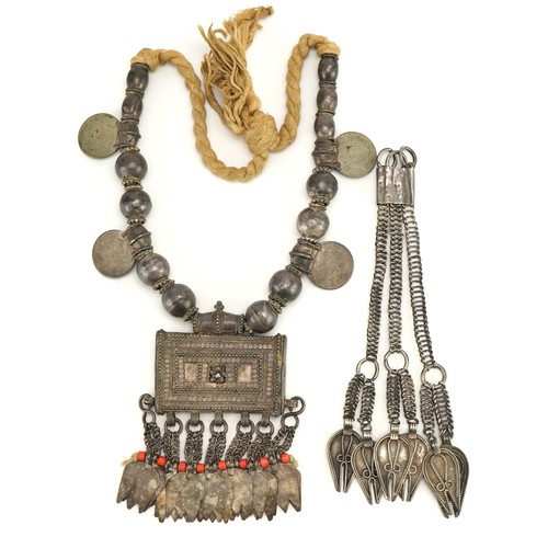 424 - Omani unmarked silver amulet with coins, together with a similar necklace, the amulet 9.5cm wide, to... 