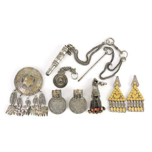 426 - Collection of Tribal interest unmarked silver jewellery including a circular brooch from Omani, the ... 