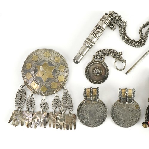 426 - Collection of Tribal interest unmarked silver jewellery including a circular brooch from Omani, the ... 