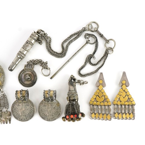 426 - Collection of Tribal interest unmarked silver jewellery including a circular brooch from Omani, the ... 