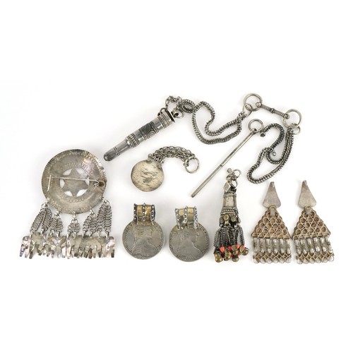 426 - Collection of Tribal interest unmarked silver jewellery including a circular brooch from Omani, the ... 