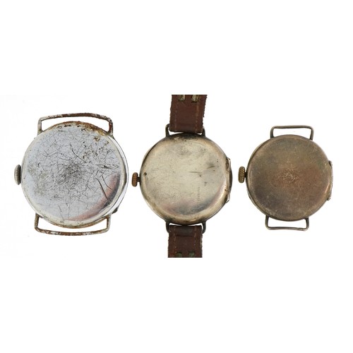 2096 - Three military interest trench watches, two silver with enamel dials, the largest 30mm in diameter