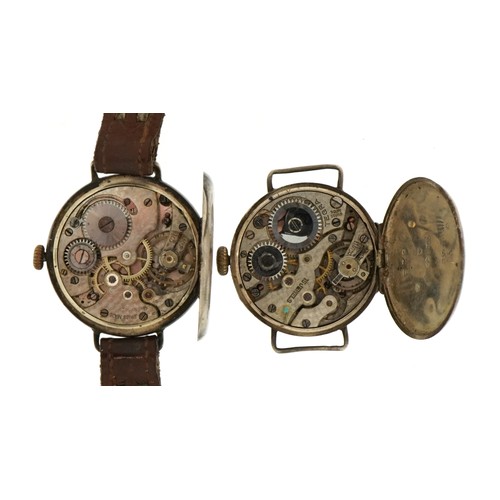 2096 - Three military interest trench watches, two silver with enamel dials, the largest 30mm in diameter