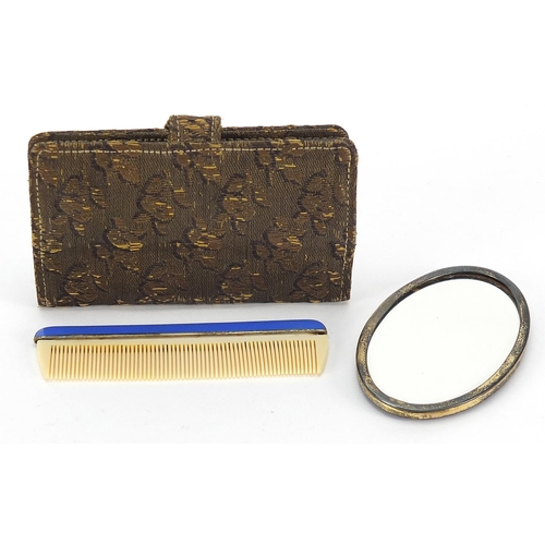 115 - Chinese or Japanese style silver gilt and enamel hand mirror and comb with embroidered case, the mir... 