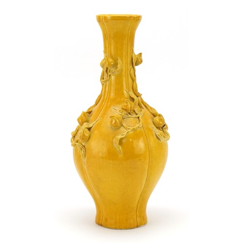 393 - Chinese porcelain vase having a yellow glaze, decorated in relief with peaches, six figure character... 