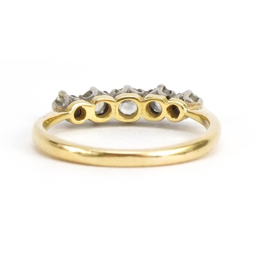 1056 - 18ct gold diamond five stone ring, the largest diamond approximately 3.1mm in diameter, size M/N, 2.... 