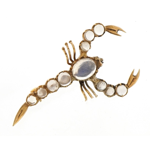 1070 - Unmarked gold cabochon moonstone scorpion brooch, 4.6cm wide, 3.4g