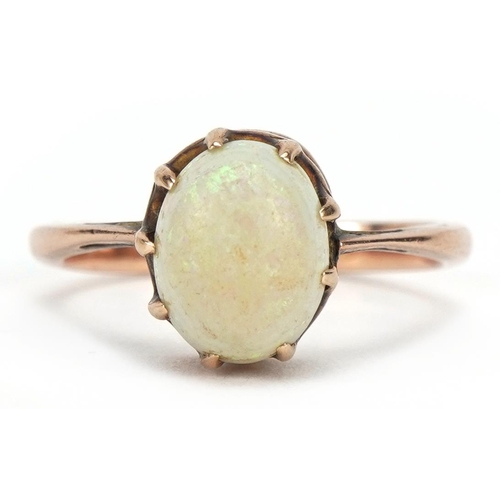 1067 - Unmarked 9ct rose gold cabochon opal ring, the stone approximately 8.4mm H x 6.9mm wide, size I, 2.0... 