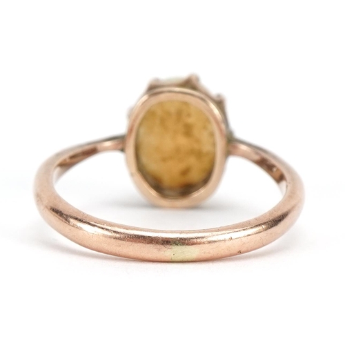 1067 - Unmarked 9ct rose gold cabochon opal ring, the stone approximately 8.4mm H x 6.9mm wide, size I, 2.0... 