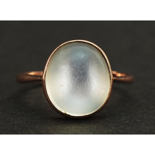 1047 - 9ct rose gold cabochon moonstone ring, the stone approximately 11.4mm x 9.9mm, size P, 2.7g