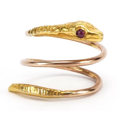 1069 - 9ct gold coiled serpent design ring with cabochon ruby eyes, 5.2g