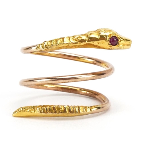 1069 - 9ct gold coiled serpent design ring with cabochon ruby eyes, 5.2g