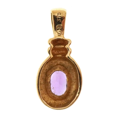 1511 - 9ct gold amethyst pendant, 1.9cm high, 1.1g