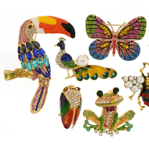 1565 - Seven jewelled and enamel animal and insect brooches including toucan, frog and peacock, the largest... 