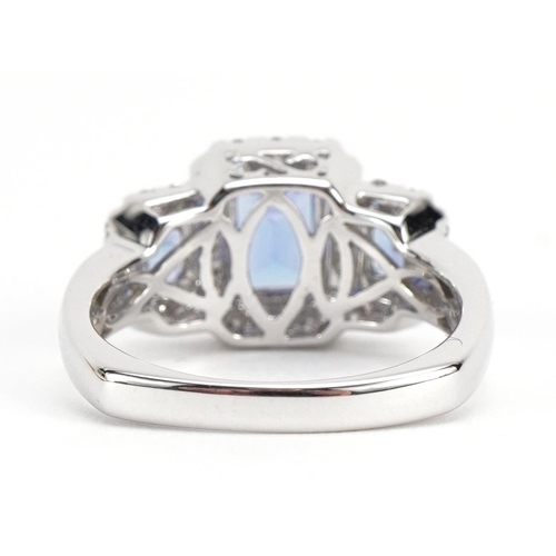 1012 - 14k white gold tanzanite and diamond cluster ring, the largest stone approximately 6.8mm x 4.8mm, si... 