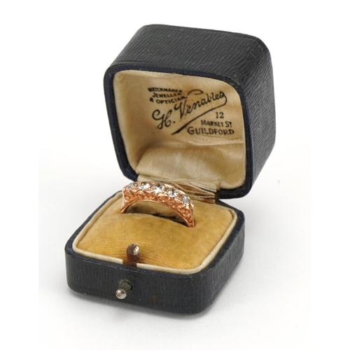1030 - Unmarked rose gold diamond five stone ring housed in an H Venables leather box, the largest diamond ... 