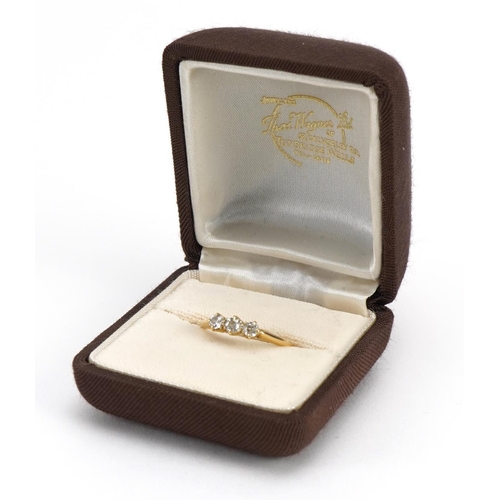 1009 - 18ct gold diamond three stone ring, the largest diamond approximately 3.4cm in diameter, size O, 2.4... 