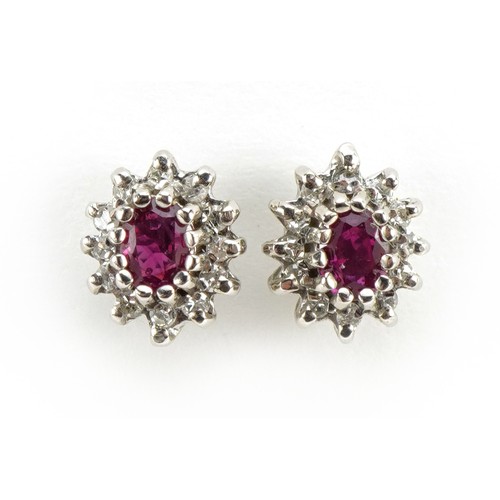 1127 - Pair of 9ct gold ruby and diamond cluster stud earrings, 8mm high, 1.7g