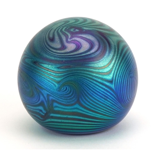 36 - Iridescent art glass paperweight with combed decoration, etched marks to the base, 6.5cm high