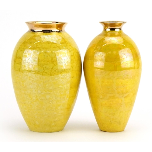 47 - Atkinson Jones, two contemporary lustreware vases having yellow glazes, each 16.5cm high