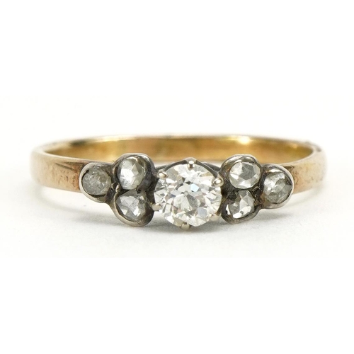 1087 - Unmarked gold diamond seven stone ring, the central diamond approximately 3.9mm in diameter, size N/... 