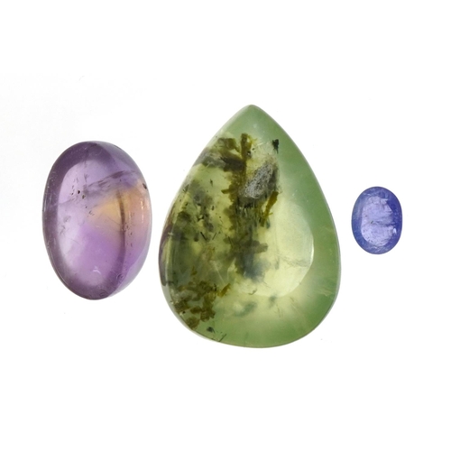 1520 - Three gemstones with certificates comprising prehnite 79.05 carat, tanzanite 2.0 carat and ametrine ... 
