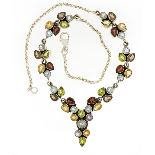 1582 - Silver multi gem necklace set with red, blue and purple stones, 43cm in length, 31.1g