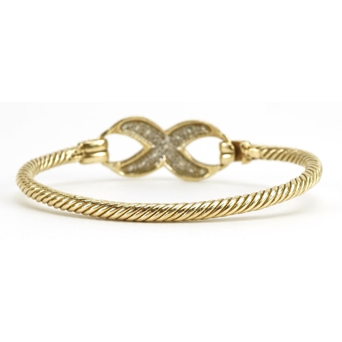 1029 - 9ct gold rope twist design infinity bangle set with clear stones, 6.8cm wide, 23.0g