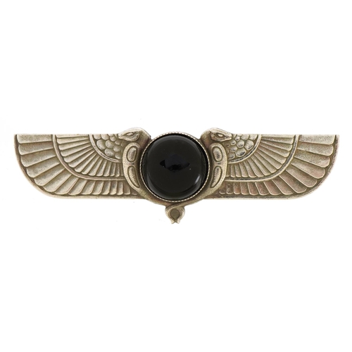 1529 - Egyptian Revival white metal brooch set with a cabochon black stone, 8cm wide, 22.5g