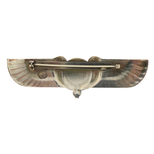 1529 - Egyptian Revival white metal brooch set with a cabochon black stone, 8cm wide, 22.5g