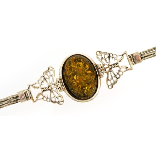 1540 - Silver butterfly bracelet set with a cabochon natural amber, 19.5cm in length, 19.2g