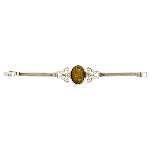 1540 - Silver butterfly bracelet set with a cabochon natural amber, 19.5cm in length, 19.2g