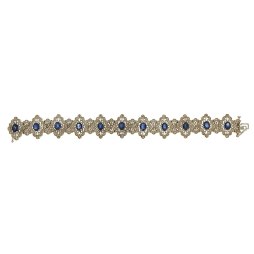 1066 - 14ct white gold sapphire and diamond bracelet, 18.5cm in length, 32.8g