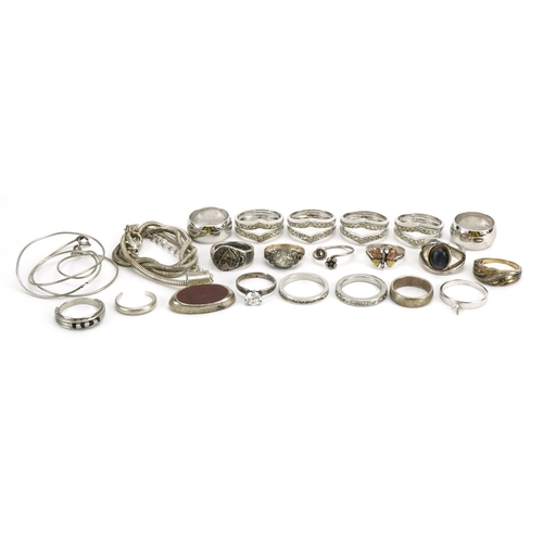 1551 - Silver and white metal jewellery comprising eighteen rings, two necklaces and a pendant, total 98.6g