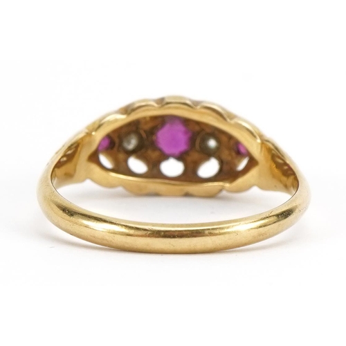 1020 - 18ct gold ruby and diamond five stone ring, the central ruby approximately 3.4mm in diameter, size L... 