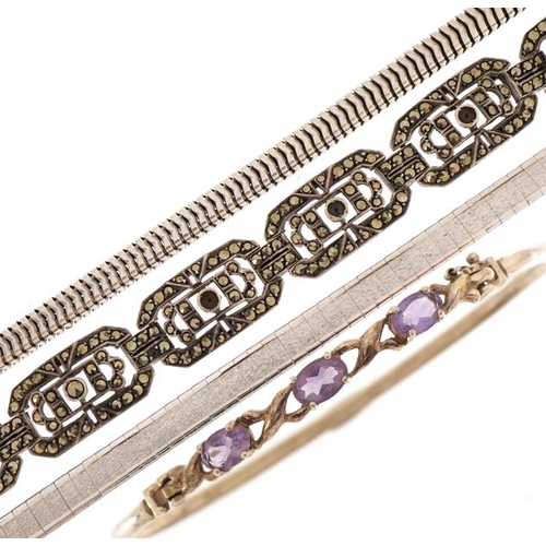 1581 - Silver jewllery comprising snake link necklace and three bracelets, one set with amethysts, total 77... 