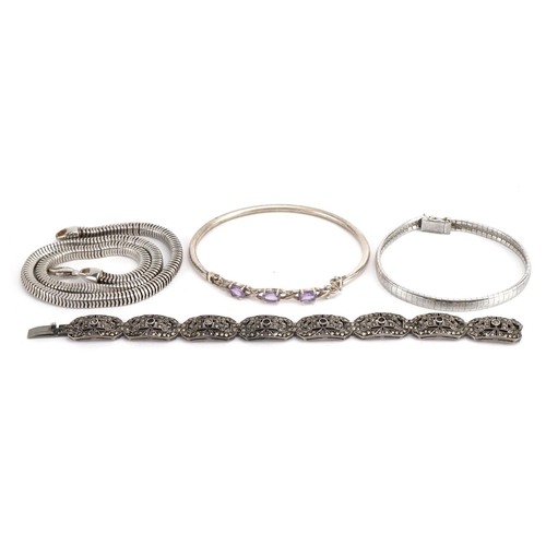 1581 - Silver jewllery comprising snake link necklace and three bracelets, one set with amethysts, total 77... 