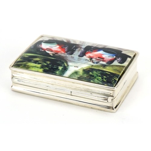 189 - Rectangular silver and enamel pill box, the hinged lid decorated with Formula 1 cars, 5cm wide, 39.0... 