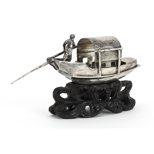 165 - Luen Wo, Chinese silver model of a boat raised on a carved hardwood stand, 9.5cm in length, 43.3g