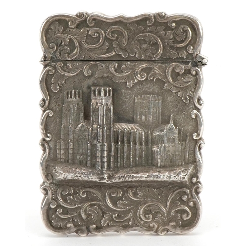 142 - Hilliard & Thomason, Victorian silver castle top card case embossed with York Minster and foliate de... 