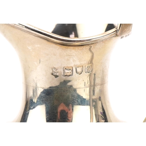 154 - Josiah Williams & Co, Edward VII silver pedestal cream jug with writhen body, London 1901, 15cm high... 