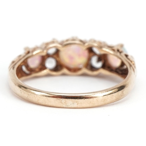 1025 - Victorian style 9ct gold clear stone and cabochon opal seven stone ring housed in a Chas Williams & ... 
