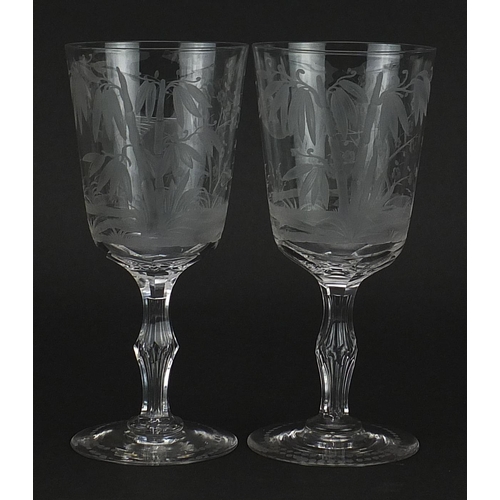 98 - Pair of aesthetic style glasses etched with cranes amongst bamboo grove and cherry blossom, each 16.... 