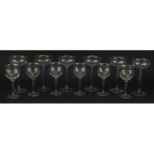 99 - Two sets of six Venetian glasses with gilt monograms and borders, the largest each 18cm high