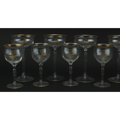 99 - Two sets of six Venetian glasses with gilt monograms and borders, the largest each 18cm high