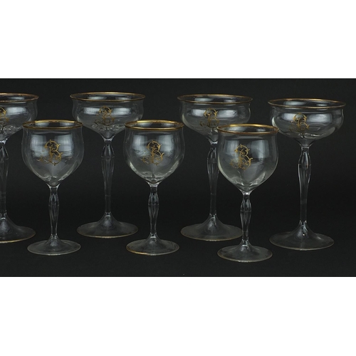 99 - Two sets of six Venetian glasses with gilt monograms and borders, the largest each 18cm high