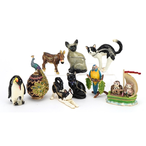 83 - Nine novelty enamelled trinket boxes in the form of animals including cats, penguins and a donkey, t... 