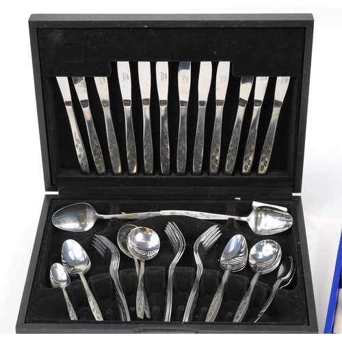 73 - Two canteens of stainless steel cutlery including a forty four piece by Viners in the Satin Leaf des... 