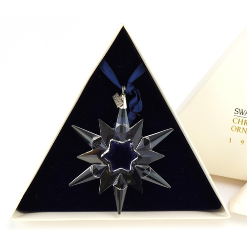 18 - Two Swarovski Crystal Christmas ornaments with boxes comprising dates 1996 and 1997